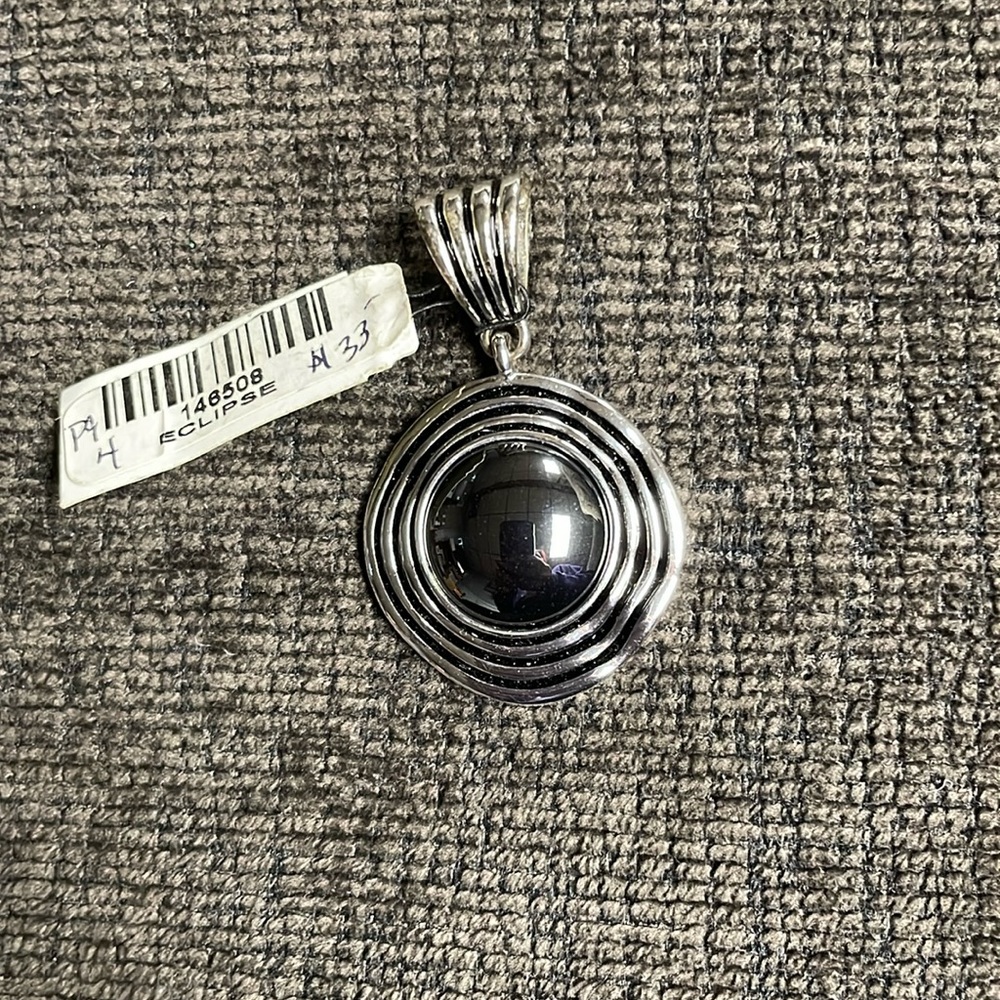 Pendant silver with hematite looking stone beautiful detailing on pendant /clasp